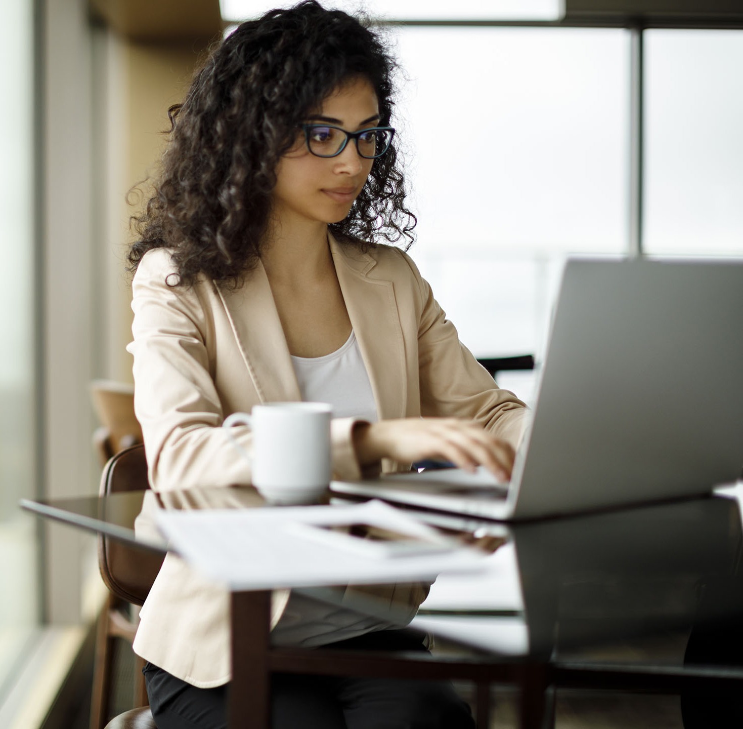 Woman taking a CompEssentials course on her laptop
